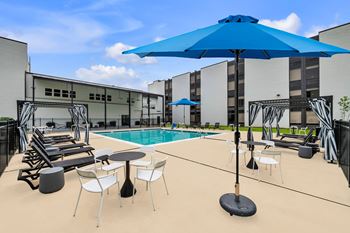 Resort-style pool with cabanas